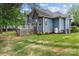 Backyard featuring an elevated deck, well-manicured lawn, and privacy landscaping at 7887 Mountain Shore Dr, Sherrills Ford, NC 28673