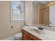 Bathroom featuring a wooden vanity with a large sink, and a tiled shower at 7887 Mountain Shore Dr, Sherrills Ford, NC 28673