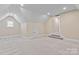 Spacious bonus room with neutral carpet, storage and natural light at 7887 Mountain Shore Dr, Sherrills Ford, NC 28673