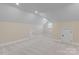 Large bonus room featuring neutral carpeting, ample lighting, and bonus storage at 7887 Mountain Shore Dr, Sherrills Ford, NC 28673