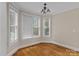 Bright dining room featuring hardwood floors, neutral paint, and lots of natural light from the multiple windows at 7887 Mountain Shore Dr, Sherrills Ford, NC 28673