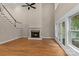 Spacious living room features a fireplace, tall ceilings, and French doors to an outdoor area at 7887 Mountain Shore Dr, Sherrills Ford, NC 28673
