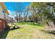 Spacious backyard with a mix of open lawn and mature trees for outdoor activities at 803 N Walnut St, Kannapolis, NC 28081