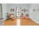 Inviting bedroom with hardwood floors, chair, and plenty of natural light at 803 N Walnut St, Kannapolis, NC 28081