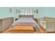 Comfortable bedroom with a bed, two nightstands, a chest, and a crib on hardwood style laminate floors at 803 N Walnut St, Kannapolis, NC 28081