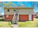 Back of house with brick foundation and stairs leading to a private entrance at 803 N Walnut St, Kannapolis, NC 28081