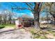 Cozy home with a large tree, offering a blend of shade and natural beauty at 803 N Walnut St, Kannapolis, NC 28081