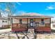 Inviting single-story home showcasing a charming front porch, brick foundation, and well-maintained landscaping at 803 N Walnut St, Kannapolis, NC 28081