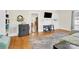 Bright living room with hardwood floors, neutral walls, and a view into the kitchen at 803 N Walnut St, Kannapolis, NC 28081