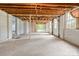 Unfinished basement with exposed ceiling and concrete floor at 828 N 6Th St, Albemarle, NC 28001