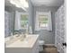 Bright bathroom with a large vanity and patterned shower curtain at 828 N 6Th St, Albemarle, NC 28001