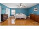Bedroom featuring wood floors and a ceiling fan for added comfort at 828 N 6Th St, Albemarle, NC 28001