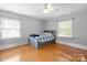 Cozy bedroom features hardwood floors and a ceiling fan at 828 N 6Th St, Albemarle, NC 28001