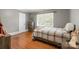 Bedroom featuring wood floors, light-filled window, and neutral paint at 828 N 6Th St, Albemarle, NC 28001