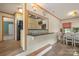 Bright dining area with a view into the kitchen, featuring stylish accents and ample natural light at 828 N 6Th St, Albemarle, NC 28001