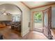 Open foyer with hardwood floors, showcasing an arched doorway leading to the living room at 828 N 6Th St, Albemarle, NC 28001