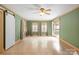Spacious living room with lots of light, decorative trim, and a sliding barn door at 828 N 6Th St, Albemarle, NC 28001