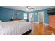 Main bedroom with hardwood floors and an ensuite bathroom at 828 N 6Th St, Albemarle, NC 28001