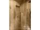 Spa-like shower with beautiful tilework and convenient built-in shelving at 828 N 6Th St, Albemarle, NC 28001
