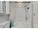 Well-lit bathroom featuring white tub/shower combo, shower curtain, and grab bars at 8819 Kishorn Ct, Charlotte, NC 28215