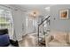 Inviting foyer with wood floors, skylight, and glass front door welcomes you home at 8819 Kishorn Ct, Charlotte, NC 28215