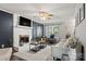 Cozy living room with a modern fireplace, neutral decor, and stylish accents at 8819 Kishorn Ct, Charlotte, NC 28215