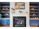 Close up on a fireplace with built-in shelving and a decorative mantle at 8905 Landsdowne Ave, Harrisburg, NC 28075