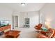 Cozy living room featuring bright paint, a large window, and comfortable seating at 8905 Landsdowne Ave, Harrisburg, NC 28075