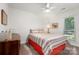Bright bedroom features a ceiling fan, neutral walls and carpet, and natural light at 901 Southland Rd, Huntersville, NC 28078
