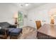 Inviting bedroom featuring a cozy sitting area, built-in storage, and natural light at 901 Southland Rd, Huntersville, NC 28078