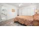 Spacious bedroom featuring plush carpet, a ceiling fan and ample closet space at 901 Southland Rd, Huntersville, NC 28078