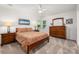 Cozy bedroom with natural light, neutral carpet, and warm wood furniture at 901 Southland Rd, Huntersville, NC 28078