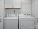 This spacious laundry room includes a side-by-side washer and dryer at 901 Southland Rd, Huntersville, NC 28078
