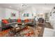 Bright living room with modern sofas, a glass coffee table, and an adjacent dining area at 901 Southland Rd, Huntersville, NC 28078