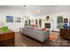 Spacious living room with a fireplace, comfortable seating, and ample natural light at 901 Southland Rd, Huntersville, NC 28078