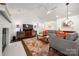 Spacious living room featuring a cozy fireplace, modern decor, and an open concept design at 901 Southland Rd, Huntersville, NC 28078