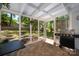 The screened porch has a tile floor, an exterior view, and a grill at 901 Southland Rd, Huntersville, NC 28078