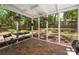 The screened porch has a tile floor, exterior view, and is great for relaxing at 901 Southland Rd, Huntersville, NC 28078