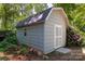 Exterior shot of a well-maintained storage shed featuring neutral siding and a convenient access door at 901 Southland Rd, Huntersville, NC 28078