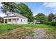 View of the rear of a home from the grass lot and landscaping behind the house at 906 Church St, Kings Mountain, NC 28086