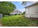 Large backyard featuring well-maintained lawn and mature trees offering shade at 906 Church St, Kings Mountain, NC 28086