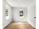 Cozy bedroom filled with natural light from multiple windows and new floors at 906 Church St, Kings Mountain, NC 28086
