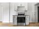Close-up kitchen view with stainless steel oven and white cabinets at 906 Church St, Kings Mountain, NC 28086