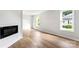 Bright living room features hardwood floors, fireplace, and plenty of natural light at 906 Church St, Kings Mountain, NC 28086