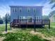 Exterior rear elevation featuring a new deck and backyard at 911 Balsam Ter, Charlotte, NC 28214