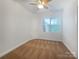 A bright bedroom features a ceiling fan and a well-lit and airy atmosphere at 911 Balsam Ter, Charlotte, NC 28214
