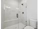 Modern tiled walk-in shower with glass door and built-in bench at 9823 Oaklawn Nw Blvd, Huntersville, NC 28078