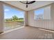 Covered deck featuring wood flooring and scenic views of the pond and surrounding landscape at 9823 Oaklawn Nw Blvd, Huntersville, NC 28078