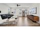 Spacious living room with hardwood floors, large windows, and stylish decor at 9823 Oaklawn Nw Blvd, Huntersville, NC 28078