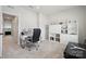 Bright home office with a desk, a chair, a window, and trophy shelving at 9823 Oaklawn Nw Blvd, Huntersville, NC 28078